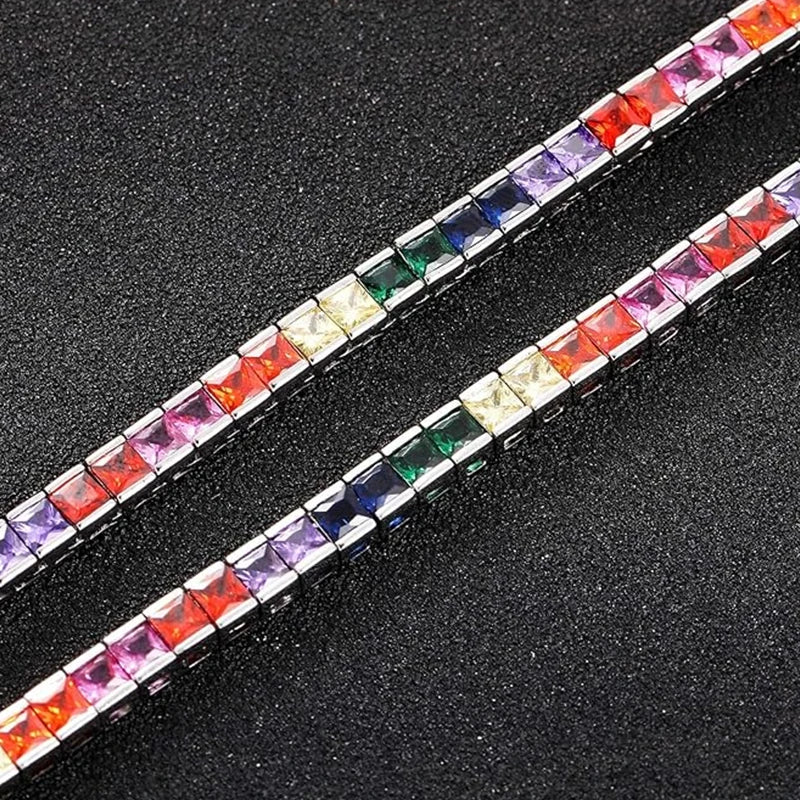 A dazzling 14K gold tennis bracelet adorned with rainbow-shaped cubic zirconia, the perfect gift for special occasions.